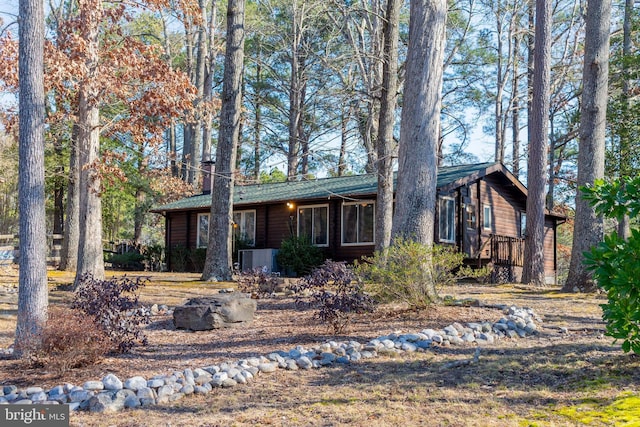 single story home with a wooden deck