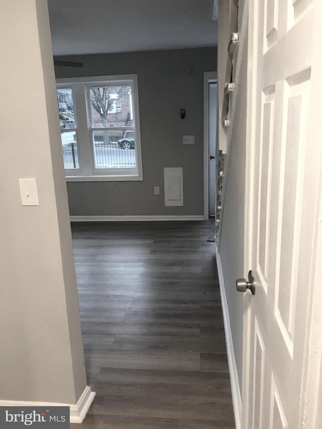 entrance foyer featuring dark wood-style floors and baseboards