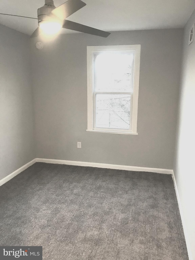 unfurnished room featuring ceiling fan, baseboards, and carpet flooring