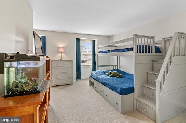 bedroom with light colored carpet