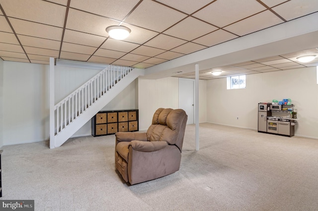 interior space with light carpet and a drop ceiling