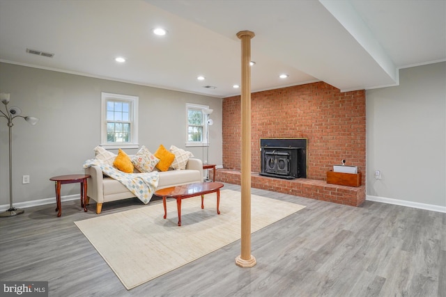 living room featuring crown molding and hardwood / wood-style floors