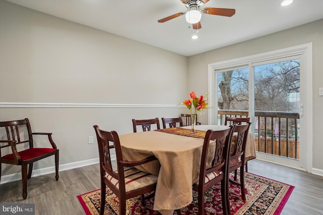 dining space featuring ceiling fan and wood-type flooring