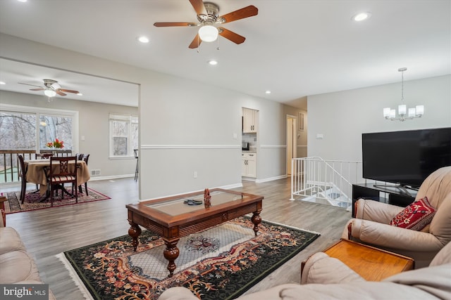 living room with hardwood / wood-style flooring and a chandelier