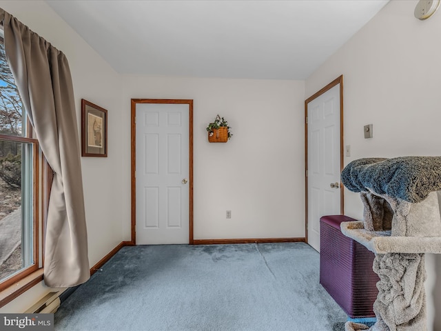 living area with light colored carpet