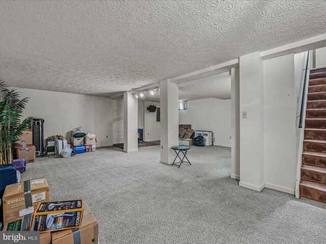 interior space with carpet flooring and a textured ceiling