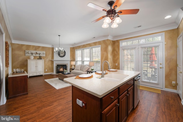 kitchen featuring dark wood-style flooring, a sink, visible vents, light countertops, and stainless steel dishwasher