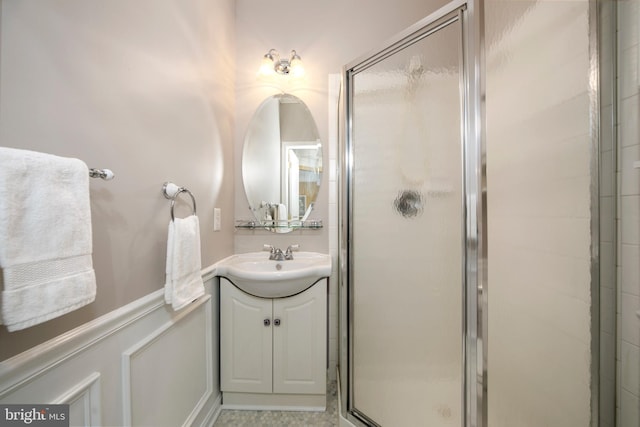 full bathroom featuring a shower stall and vanity