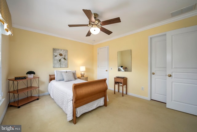 bedroom with ornamental molding, light colored carpet, visible vents, and baseboards