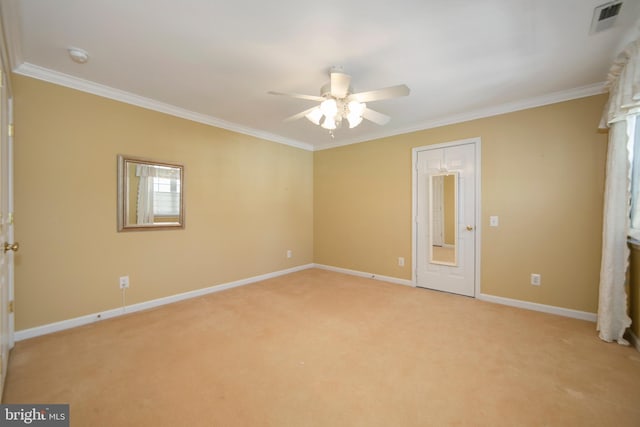 unfurnished bedroom featuring light carpet, baseboards, visible vents, and crown molding