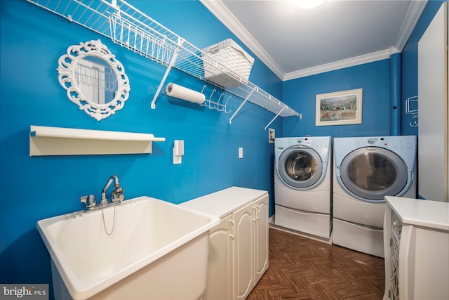 laundry room with laundry area, crown molding, a sink, and independent washer and dryer