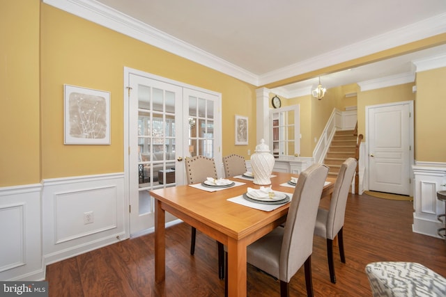 dining area with dark wood-style floors, decorative columns, stairs, and french doors