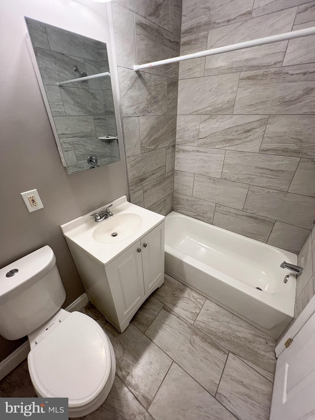 bathroom with vanity, shower / tub combination, and toilet