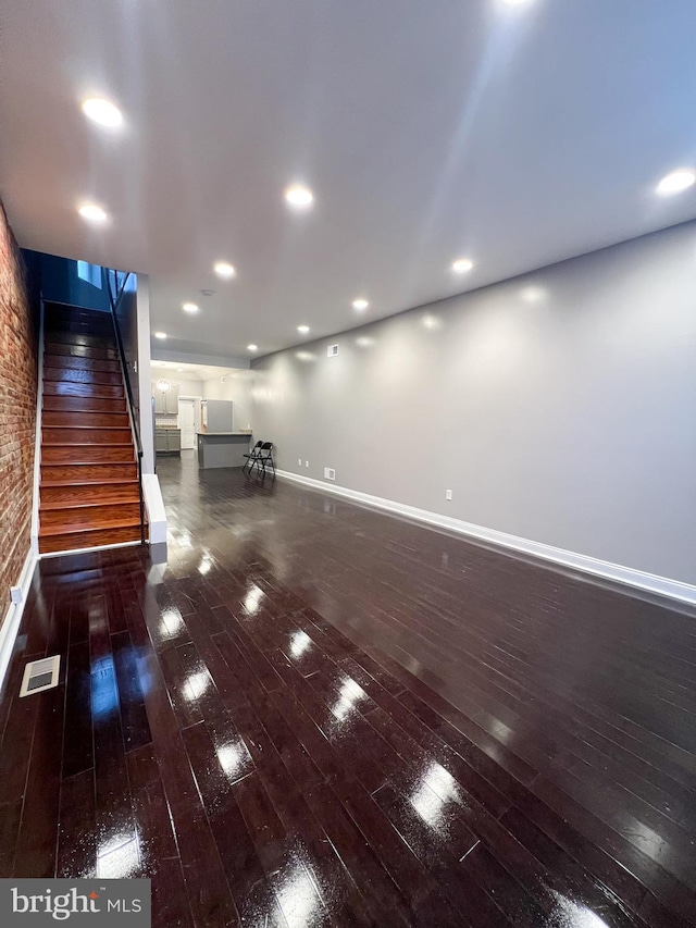 interior space featuring visible vents, recessed lighting, stairs, and wood-type flooring