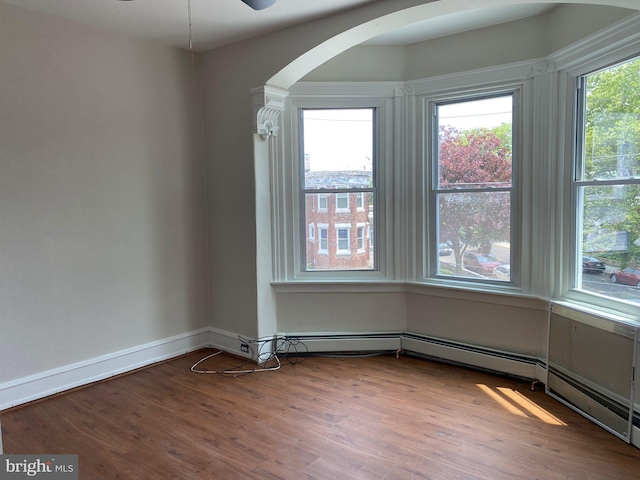 spare room with ceiling fan and hardwood / wood-style floors