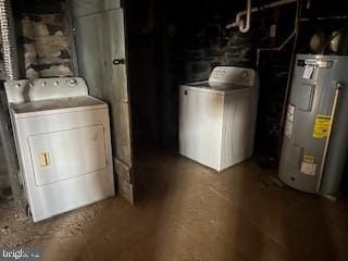 laundry room with washer and clothes dryer and electric water heater