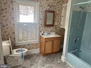 full bathroom featuring vanity, tub / shower combination, and toilet