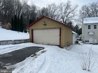 view of snow covered garage