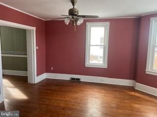 unfurnished room featuring ceiling fan, ornamental molding, and hardwood / wood-style floors