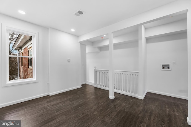 unfurnished room featuring dark hardwood / wood-style flooring