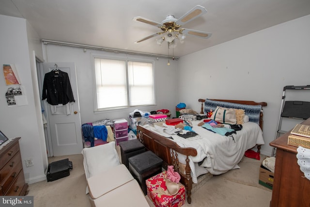 bedroom featuring light carpet and ceiling fan