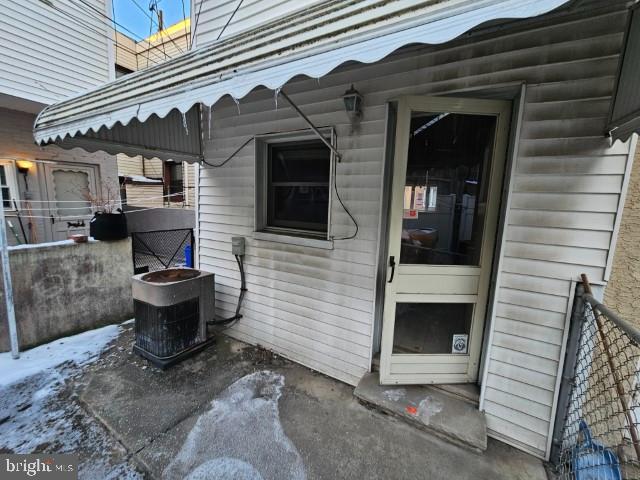 property entrance with central air condition unit