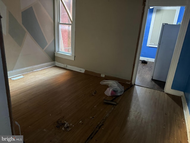 empty room with wood-type flooring