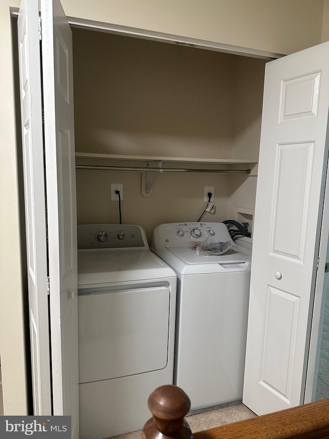 washroom featuring independent washer and dryer