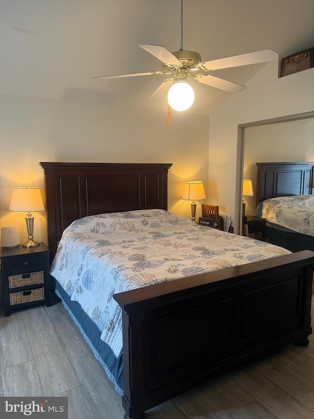 bedroom with ceiling fan and wood-type flooring