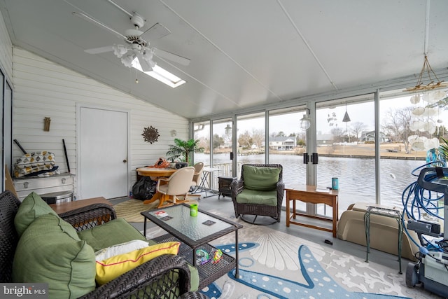 sunroom / solarium featuring a water view, lofted ceiling, and ceiling fan