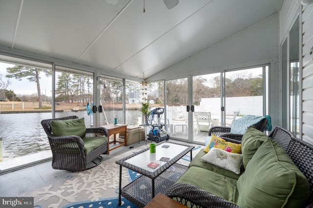 sunroom with a water view and vaulted ceiling