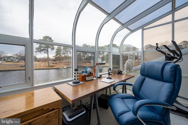 sunroom / solarium with a water view