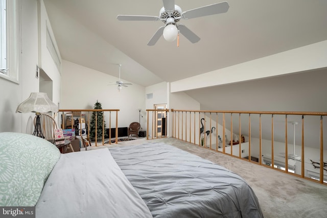 carpeted bedroom with vaulted ceiling and ceiling fan