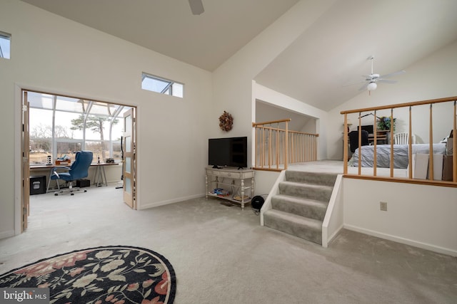 carpeted bedroom with high vaulted ceiling and ceiling fan