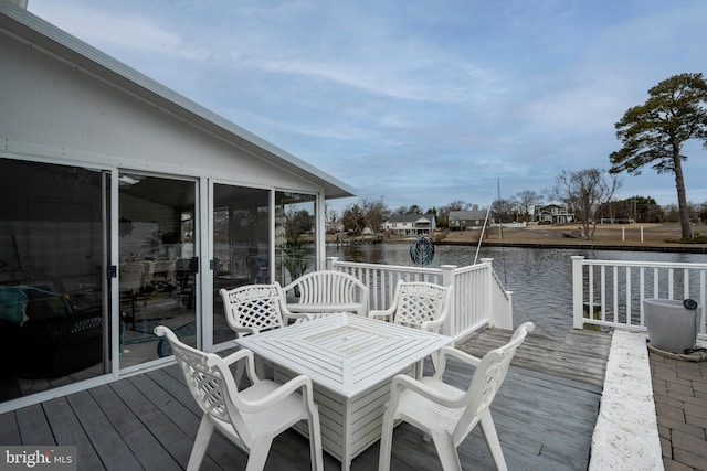 wooden deck with a water view