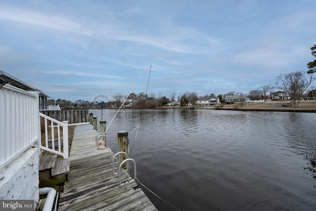 dock area with a water view