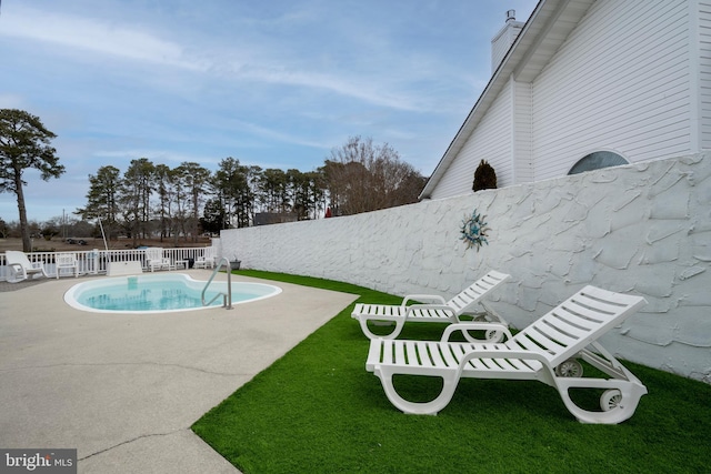 view of pool featuring a patio