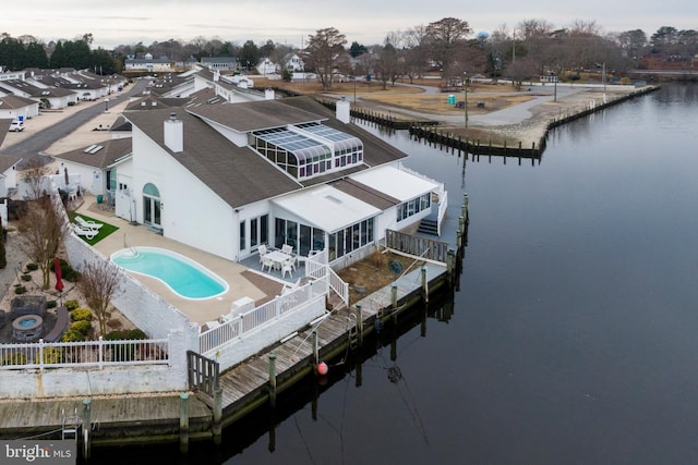 exterior space featuring a water view and a patio