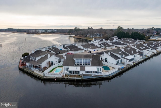 aerial view at dusk with a water view