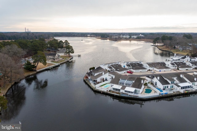 aerial view at dusk with a water view