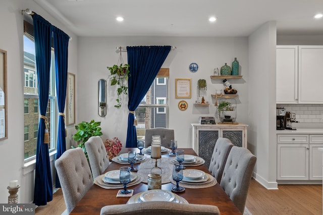 dining area featuring light wood-type flooring