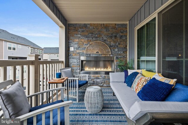 view of patio with an outdoor stone fireplace