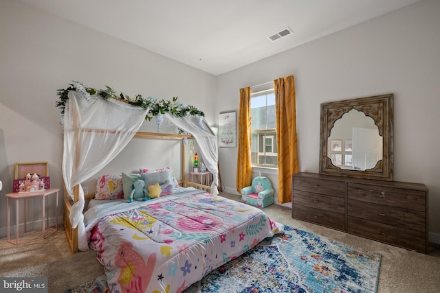 bedroom featuring light colored carpet