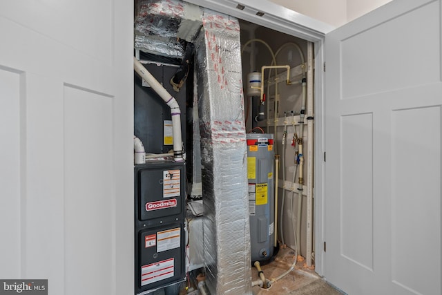 utility room featuring water heater