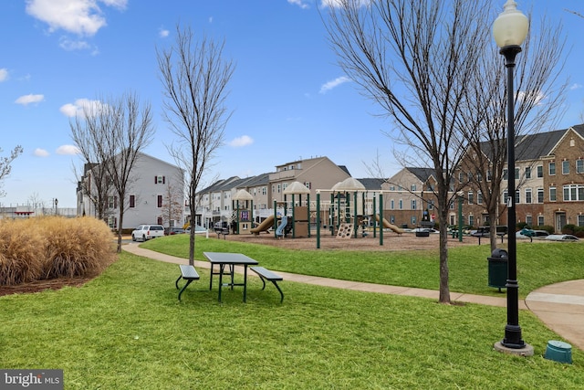 surrounding community with a playground and a lawn