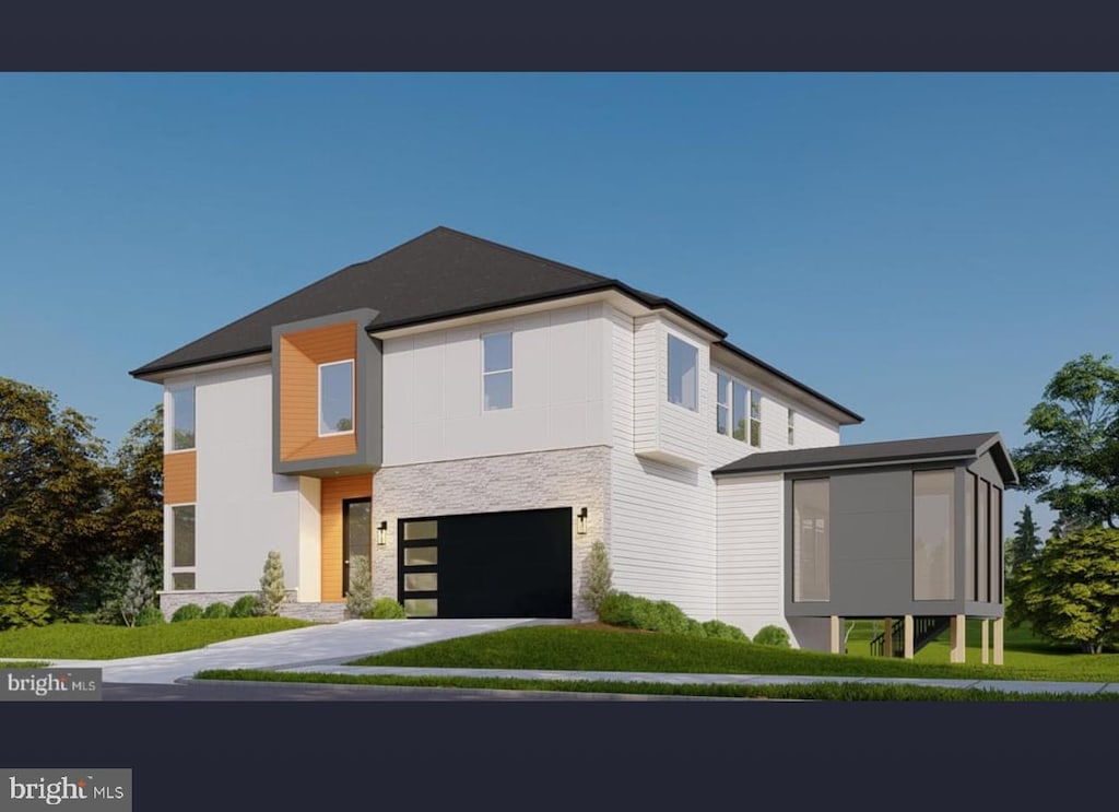 modern home with a garage and a sunroom