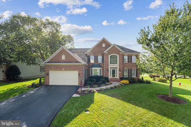 view of front of house featuring a garage and a front yard