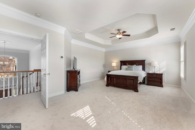 bedroom featuring light carpet, crown molding, ceiling fan with notable chandelier, and a tray ceiling