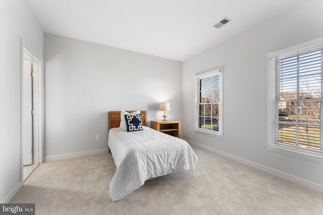 bedroom with light carpet