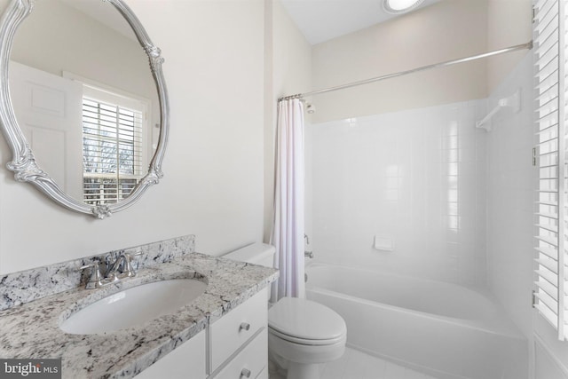 full bathroom featuring shower / bathtub combination with curtain, vanity, and toilet